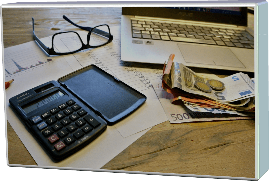 A picture of an office desk with a calculator and keyboard
