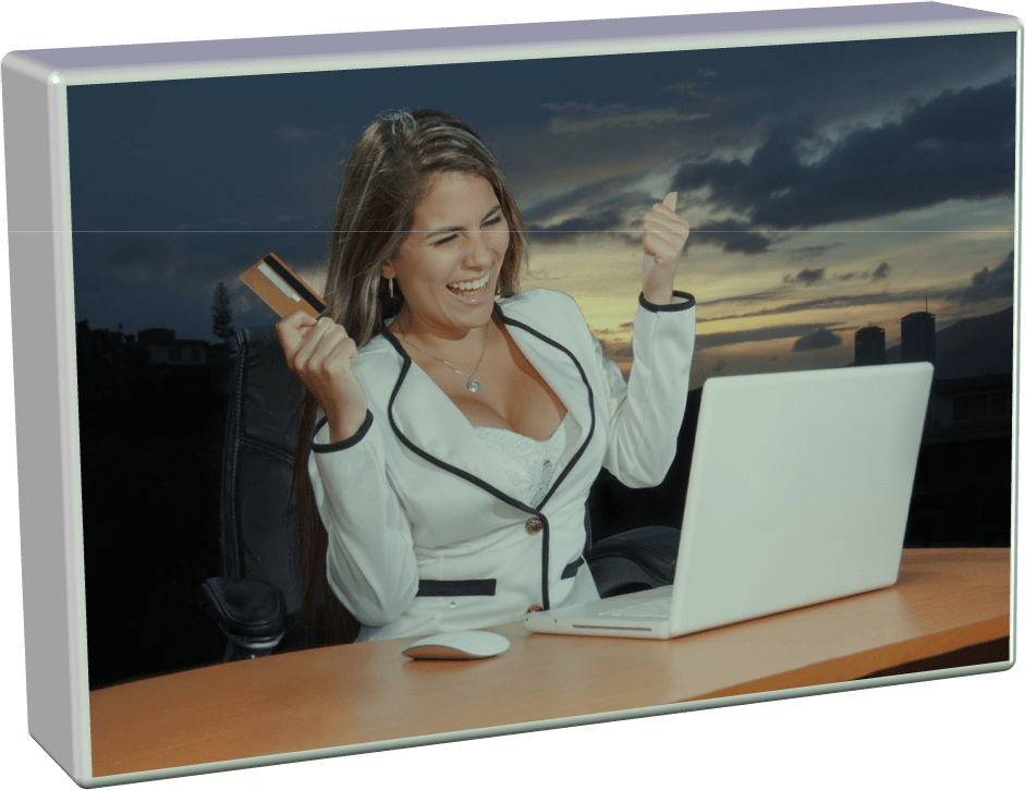 A picture of a woman at a computer happy about savings